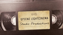 a close up of a vhs tape labeled greene light cinema studio productions