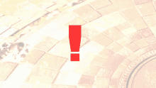 a red exclamation point is displayed on a brick walkway