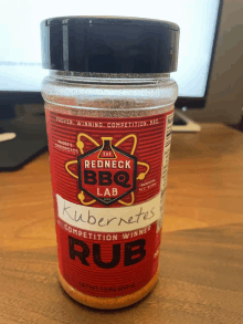 a jar of rub from the redneck bbq lab sits on a table