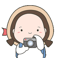 a cartoon girl is holding a camera and smiling