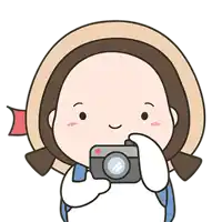 a cartoon girl is holding a camera and smiling