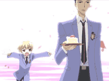 a man in a suit and tie is holding a cake