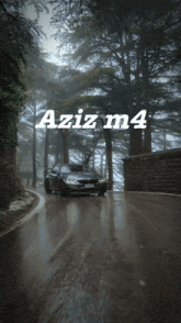 a car is driving down a road with the words aziz m4 written on it