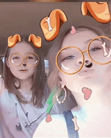 two girls wearing glasses with a dog nose and bones on their faces