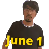 a man wearing glasses and a black shirt with the word june 1 on it
