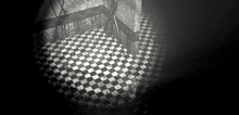 black and white photo of a checkered floor