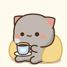 a cartoon cat is drinking a cup of coffee while sitting on a pillow .