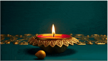 a candle is lit in a gold container on a green background