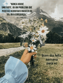 a person is holding a bouquet of flowers with a quote from bern williams