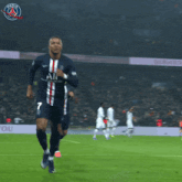 a soccer player wearing a number 7 jersey is running on the field