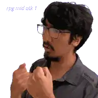 a man with glasses and a beard is making a gesture