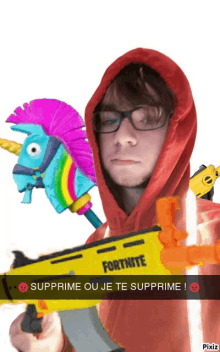 a man in a red hoodie is holding a fortnite toy gun