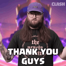 a man wearing glasses and a purple hat says " thank you guys "