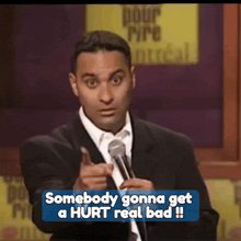a man speaking into a microphone with the words somebody gonna get a hurt real bad below him