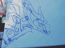 a drawing of a dragon on a piece of paper that says blue h