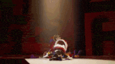 a cartoon character is laying on the floor in a room with a lot of toys .