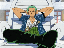 a man with green hair is sitting with his hands behind his head and holding a sword