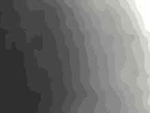 a close up of a gray background with a gradient of light and shadow .