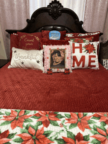 a bed with a picture of a woman and a pillow that says home