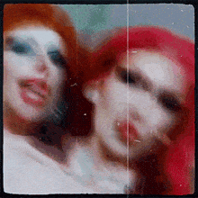 two women with red hair are standing next to each other