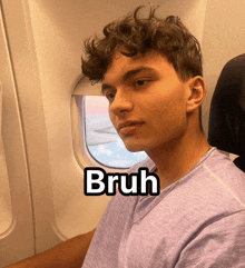 a man in a purple shirt is sitting on an airplane with the word bruh above him