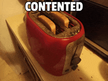 a red toaster with two slices of bread in it and the words contented above it