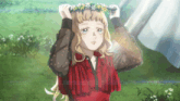 a girl in a red dress is wearing a wreath of daisies on her head