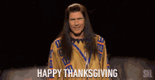 a man in a native american outfit is saying " happy thanksgiving "