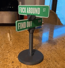 a small street sign that says fuck around st and find out on it