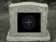 a black and white photo of a gravestone with a cross in the center