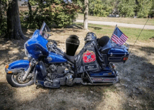 a harley davidson motorcycle is parked in a grassy area