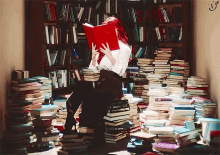 a woman is sitting on a pile of books reading a book called " a brief history of time "