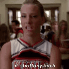 a cheerleader says it 's brittany bitch in front of a crowd of people