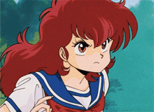 a girl with red hair is wearing a sailor uniform and pointing at something