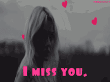 a black and white photo of a woman with the words " i miss you "