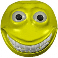 a close up of a yellow smiley face with big teeth .