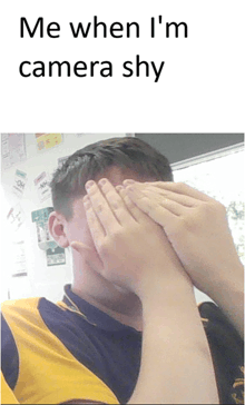 a man covering his face with his hands with the caption " me when i 'm camera shy " above him