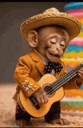 a monkey is wearing a sombrero and holding a guitar