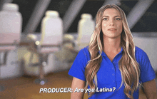 a woman in a blue shirt says producer are you latina in a video