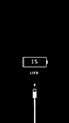 a black background with a charging cable and a battery that is 1% full .