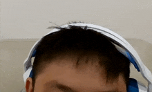 a close up of a person 's head with headphones