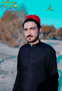 a man wearing a black shirt and a red hat is standing in front of a blue background with a bird and the year 2023