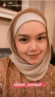 a woman wearing a hijab with the words salam jumaat written below her