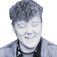 a black and white photo of a smiling woman with curly hair