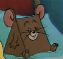 a close up of a cartoon mouse sitting on a pillow on a bed .