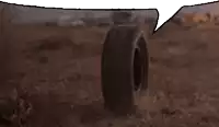 a tire is laying on the ground with a speech bubble above it