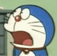 a close up of a doraemon cartoon character with its mouth open .