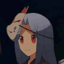 a girl with long blue hair is wearing a fox mask