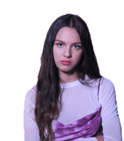 a woman with long hair is wearing a white shirt and a purple top