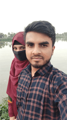 a man and a woman are posing for a picture together